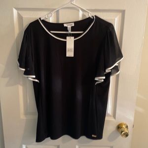 Woman’s Large Calvin Klein blouse.